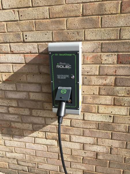 Rolec SecuriCharge EV charger on brick wall