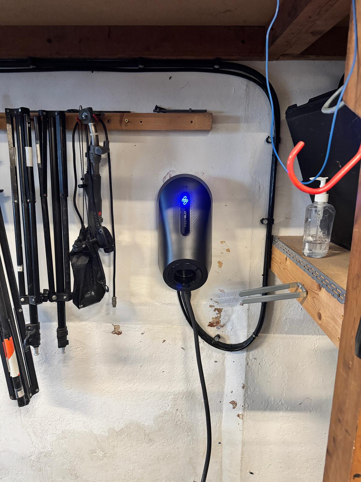 Zappi GLO charger mounted in garage